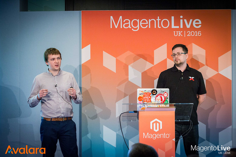 A photograph of Max with colleague Marcin, presenting a talk at the conference Magento Live UK, 2016
