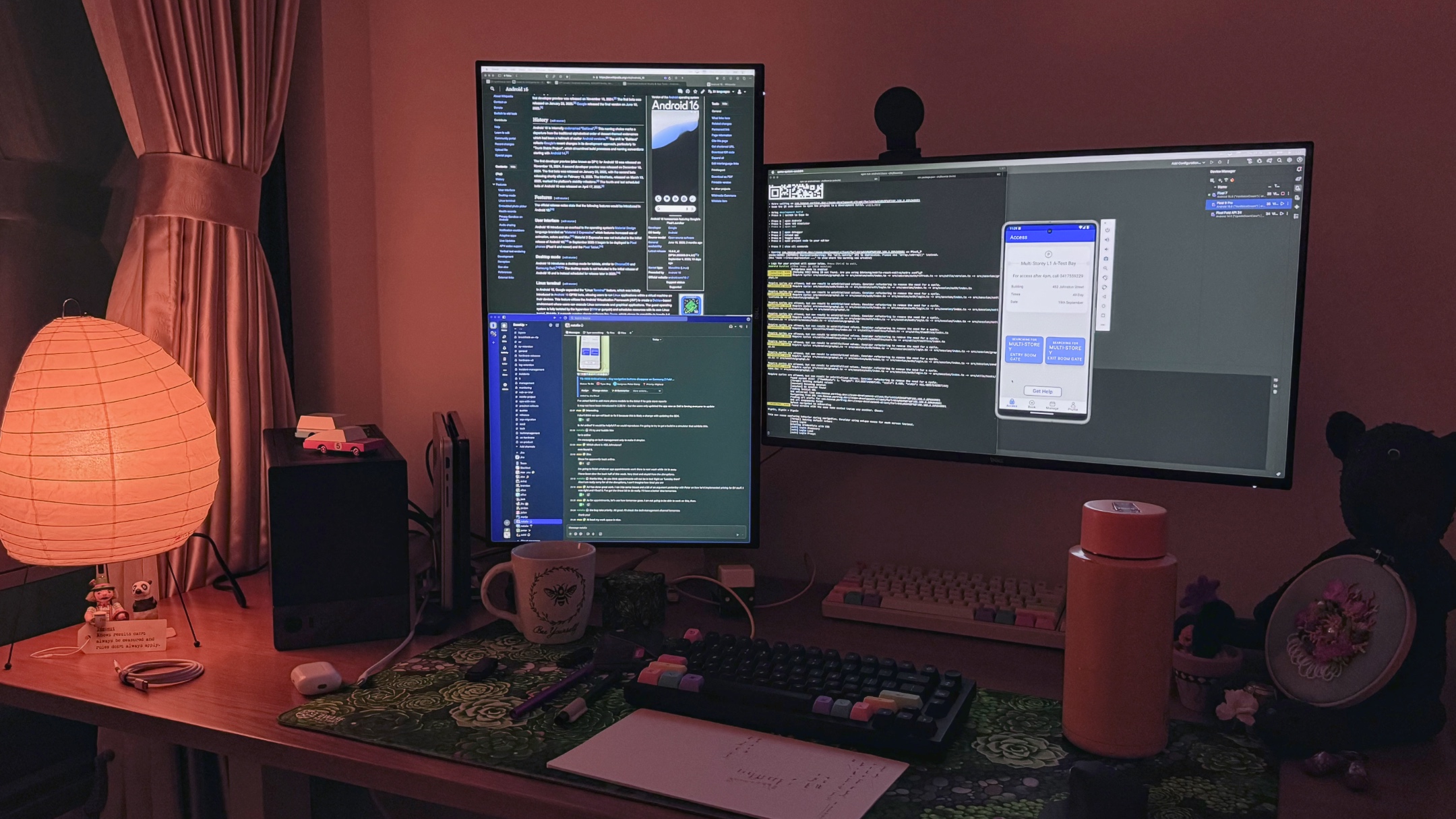 An evening picture of my desk, showing dual monitors, my PC, a Noguchi lamp, and other paraphernalia.